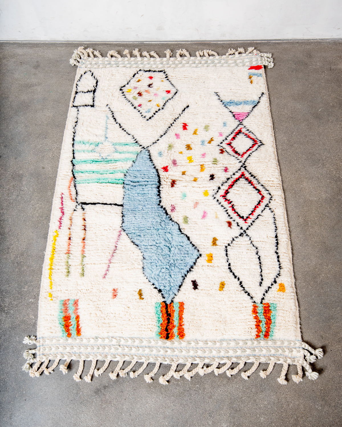 Modern, designer, handcrafted Berber rug from Morocco. Beniourain carpet with beautiful colours and patterns and fluffy wool texture.